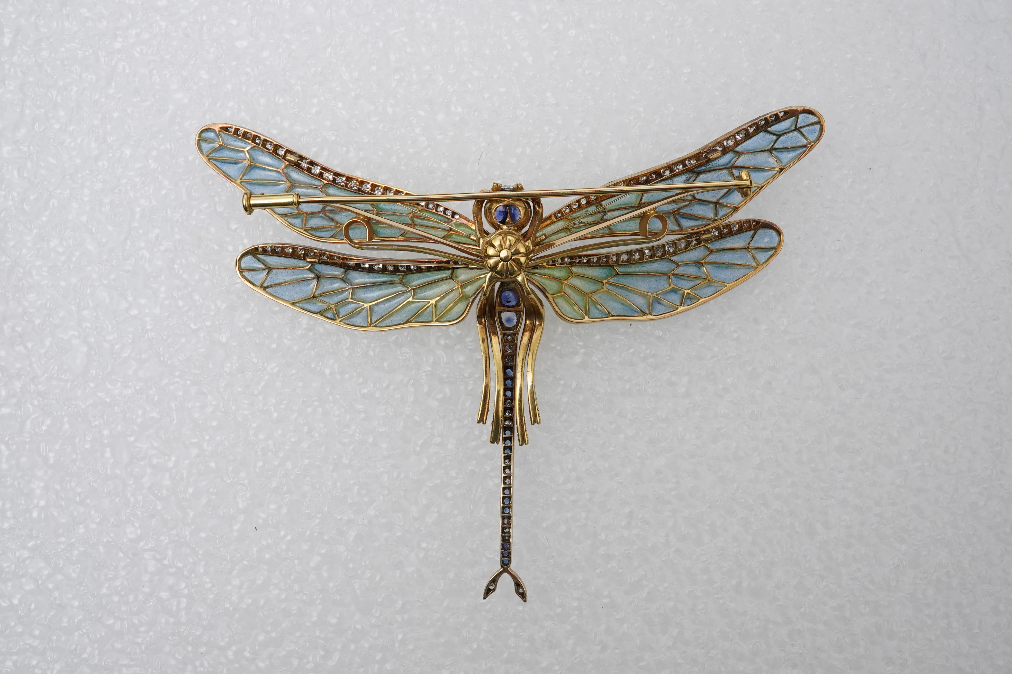 An enamel, sapphire and diamond dragonfly brooch